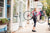 woman holding bike in town