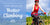 photo of woman climbing a hill on a bicycle, smiling, with dramatic nountain scenery in the background